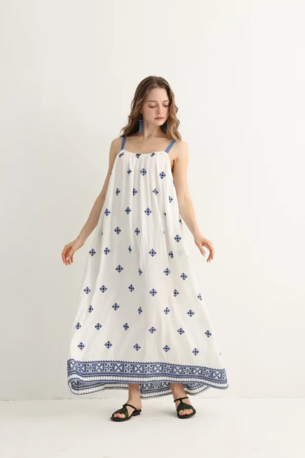 navy floral embroidery on Greek-inspired white maxi dress