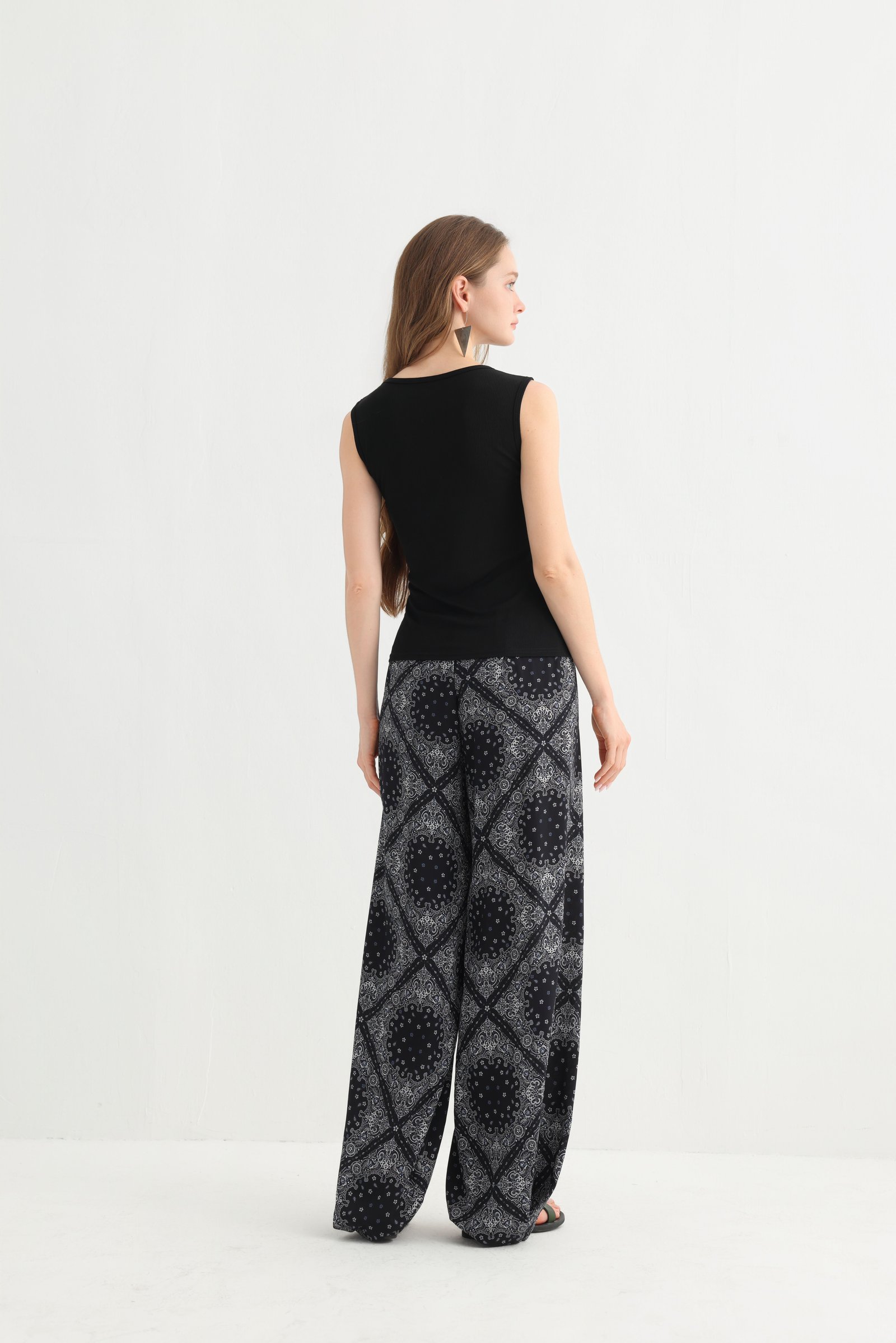 Closer front view of the black geometric vacation pants