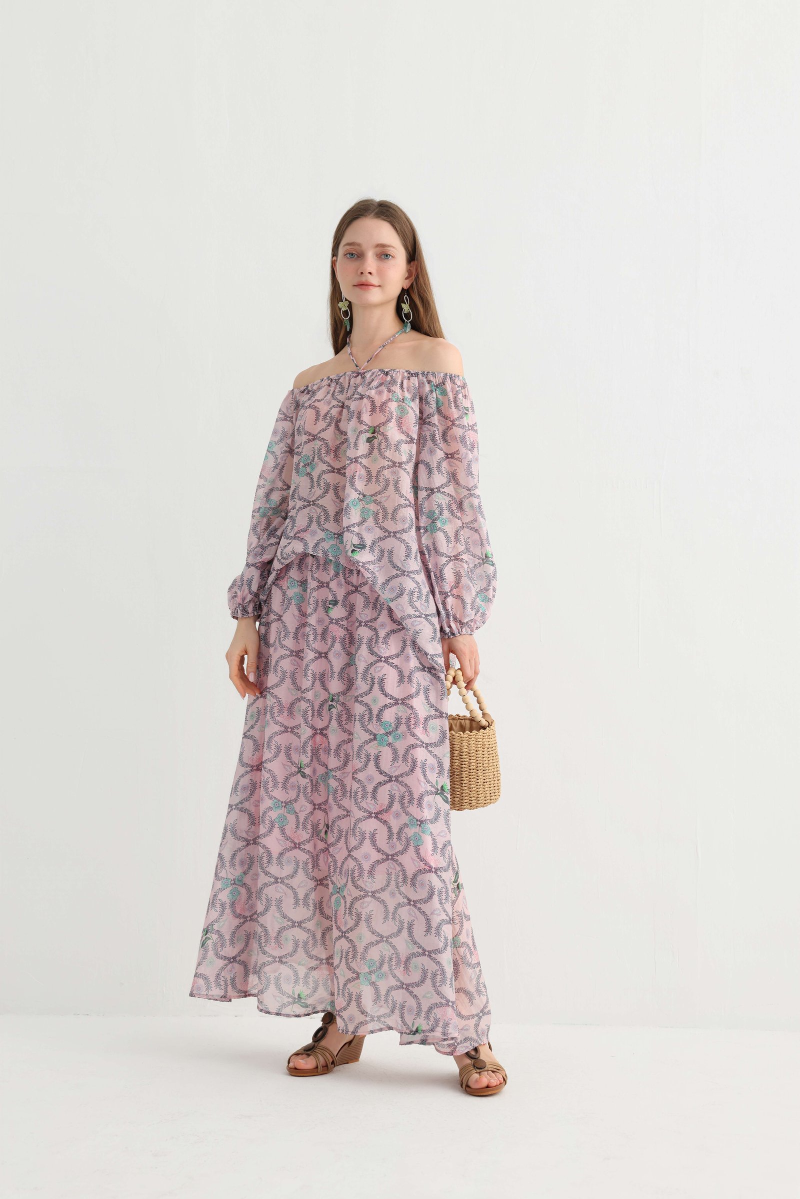 Front pose showing the off-shoulder top and printed maxi skirt