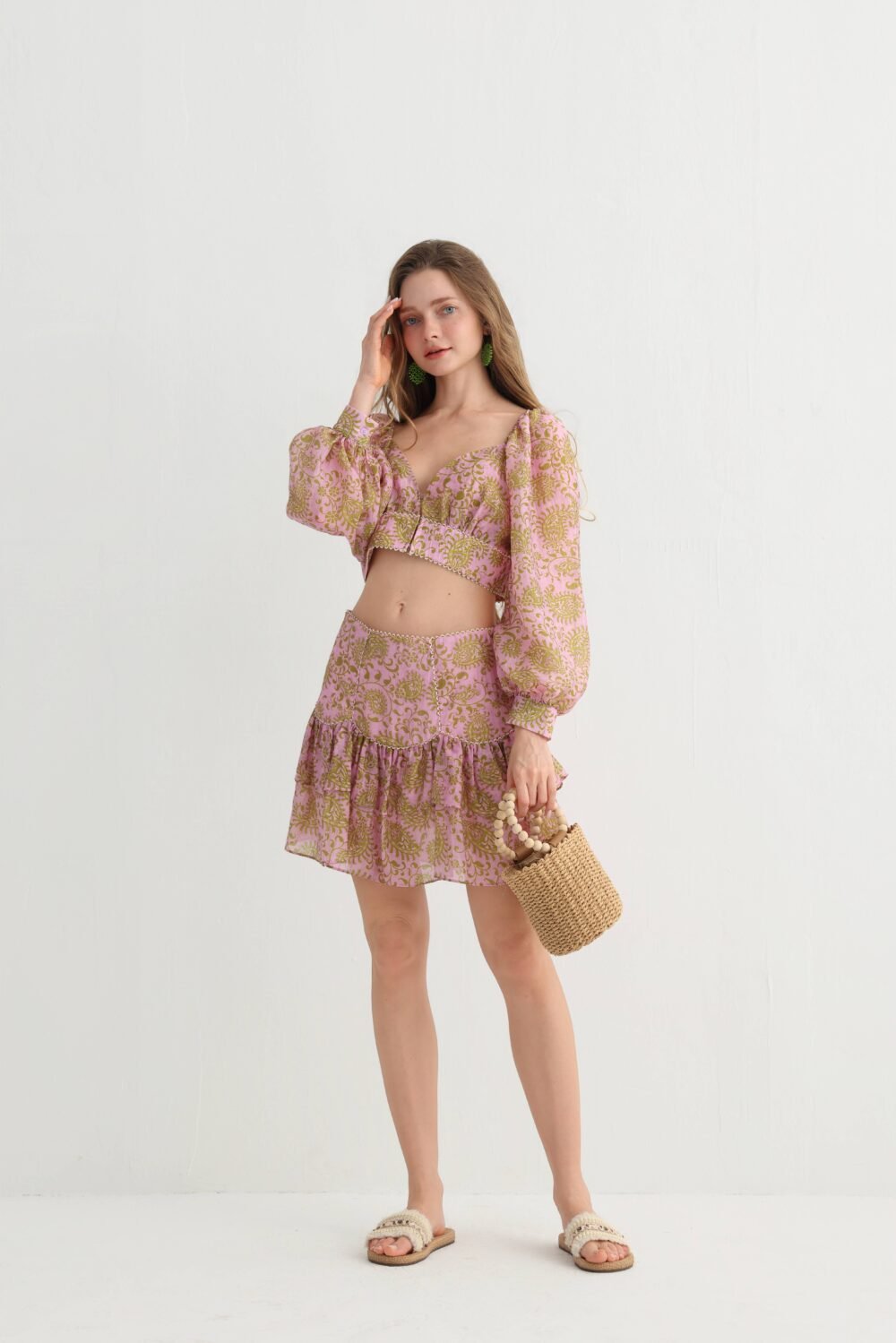Full-length view of the lantern-sleeve crop top and ruffle skort
