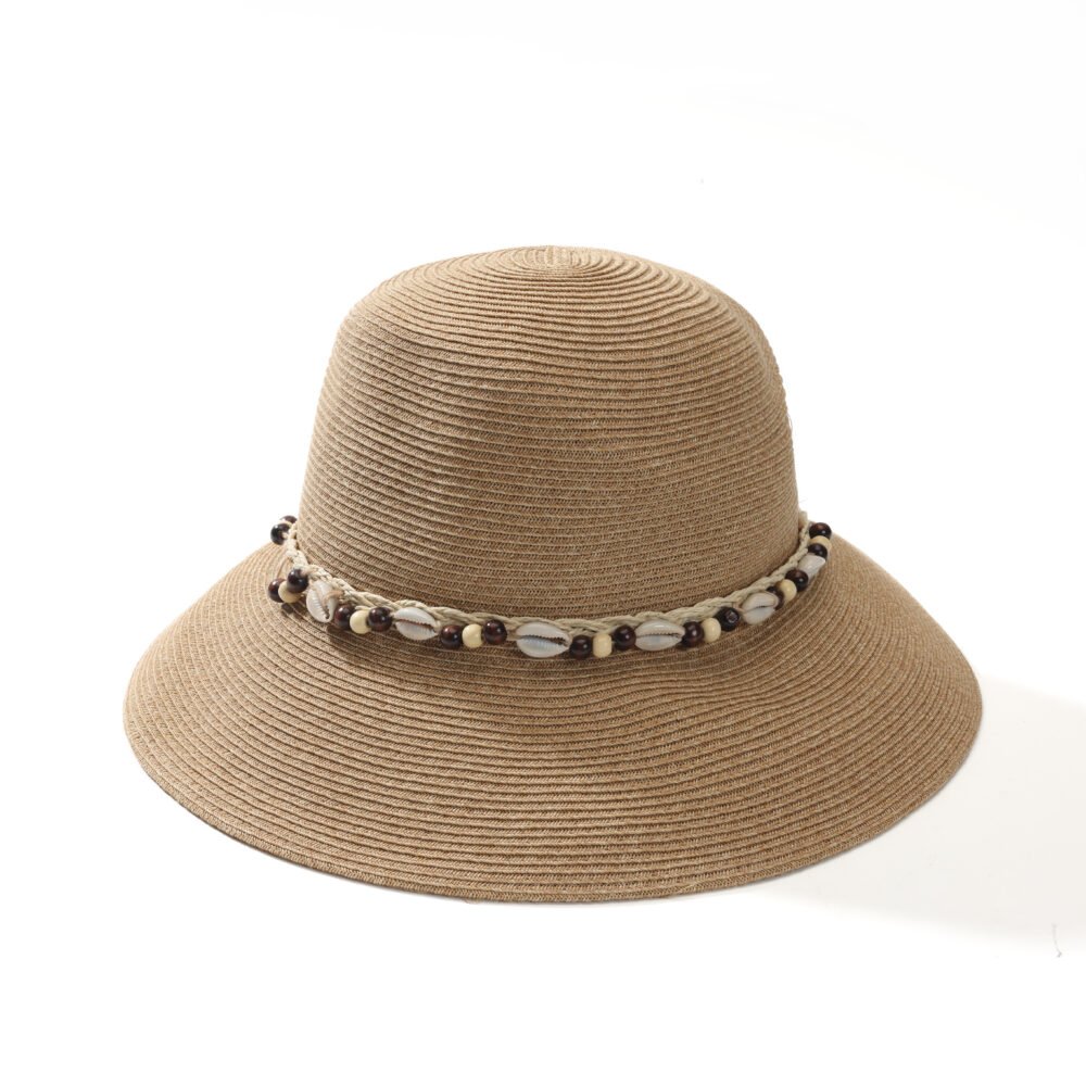 Cowrie shell beaded sun hat with natural woven texture and wide brim