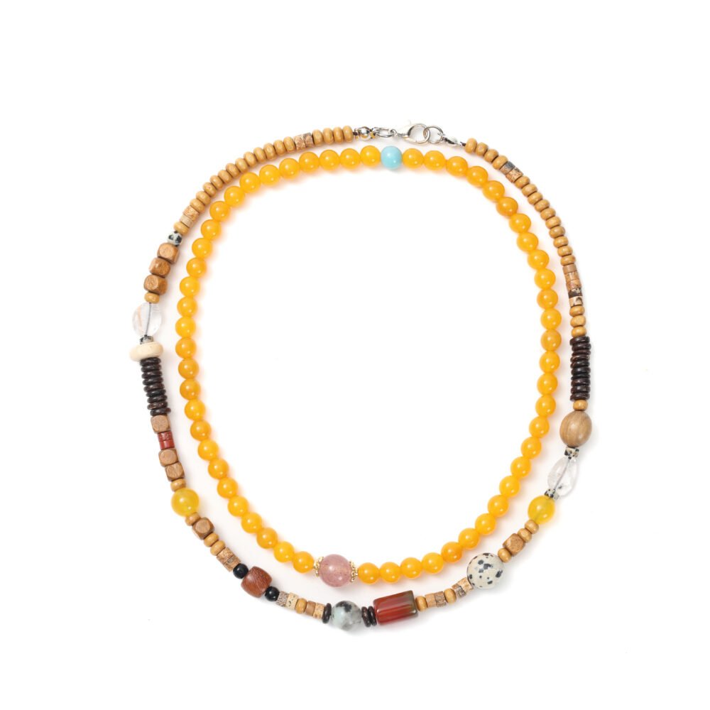 Yellow layered beaded necklace with bright round beads and mixed wood and stone accents