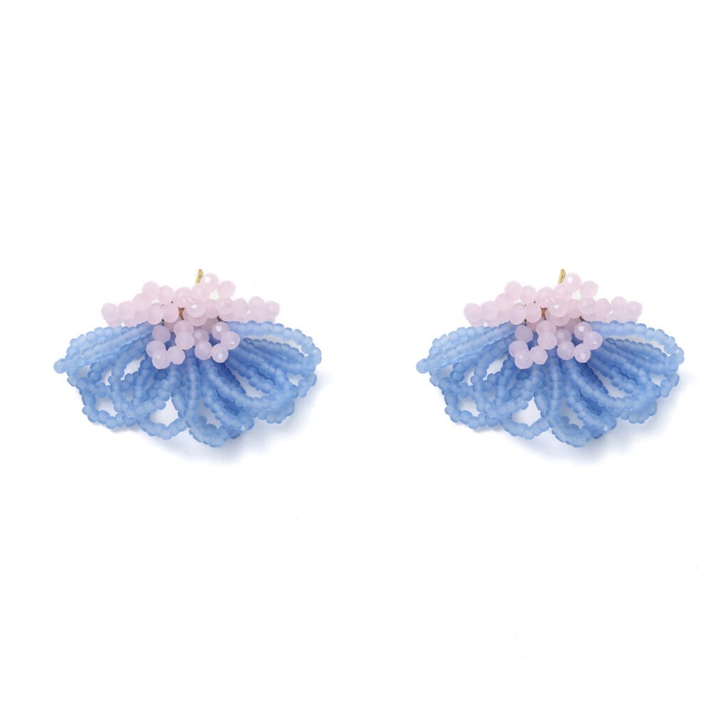 Powder blue beaded flower drop earrings with blush bead accents on a white background
