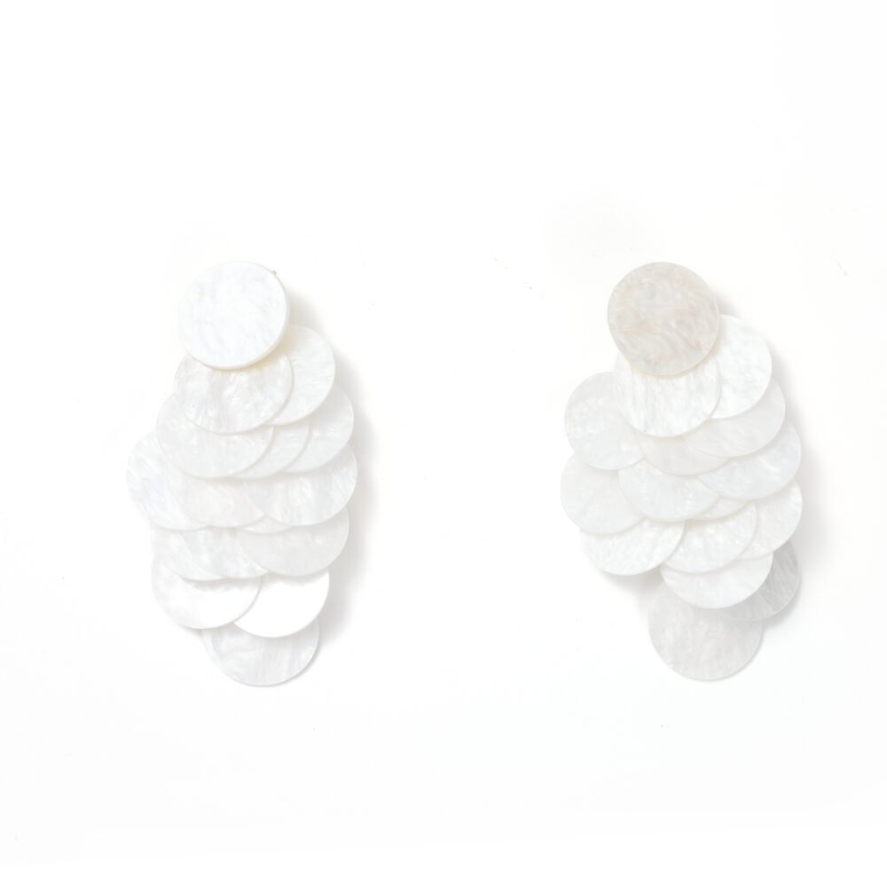 Ivory layered shell drop earrings with overlapping round discs on a white background
