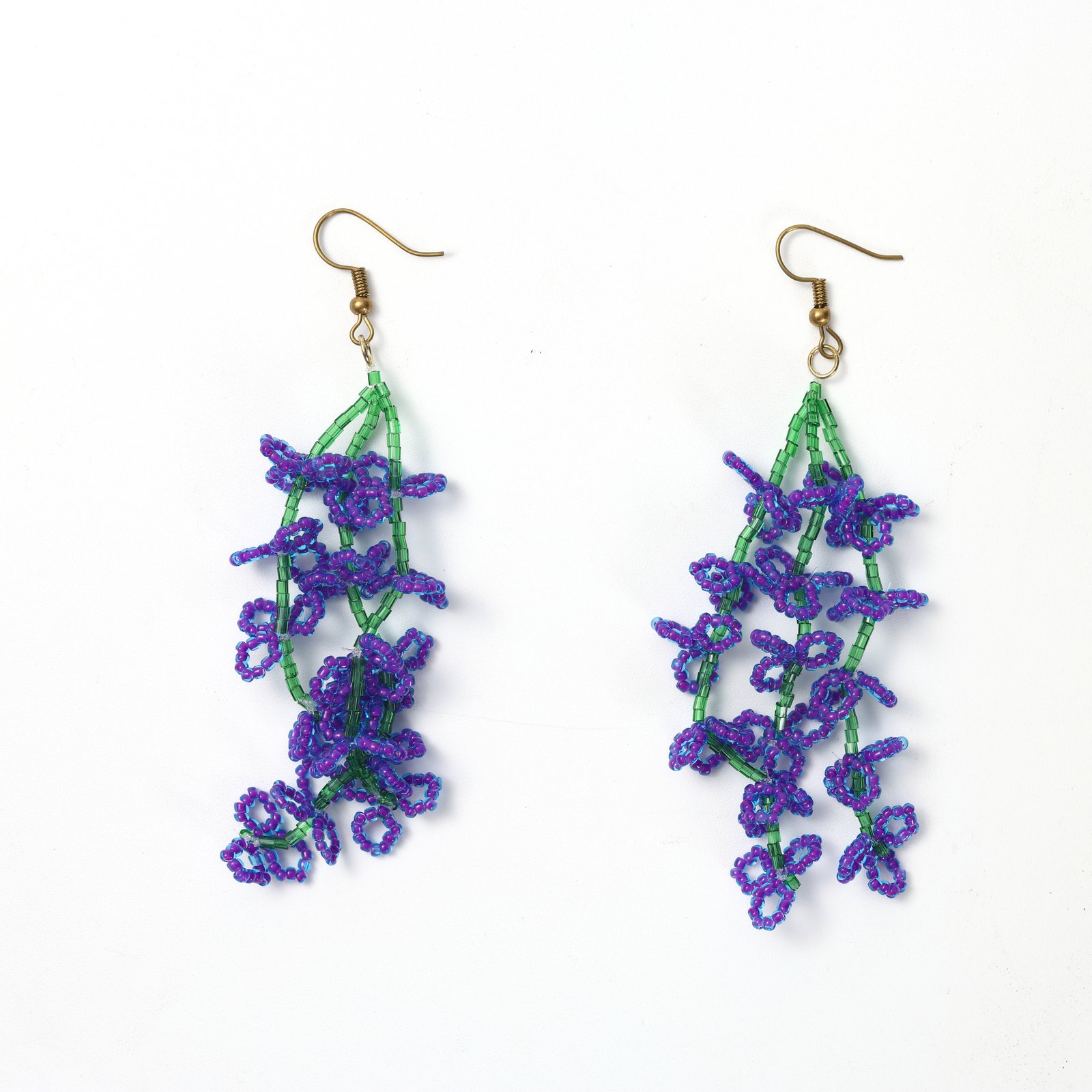 Purple wisteria beaded drop earrings with cascading green floral stems