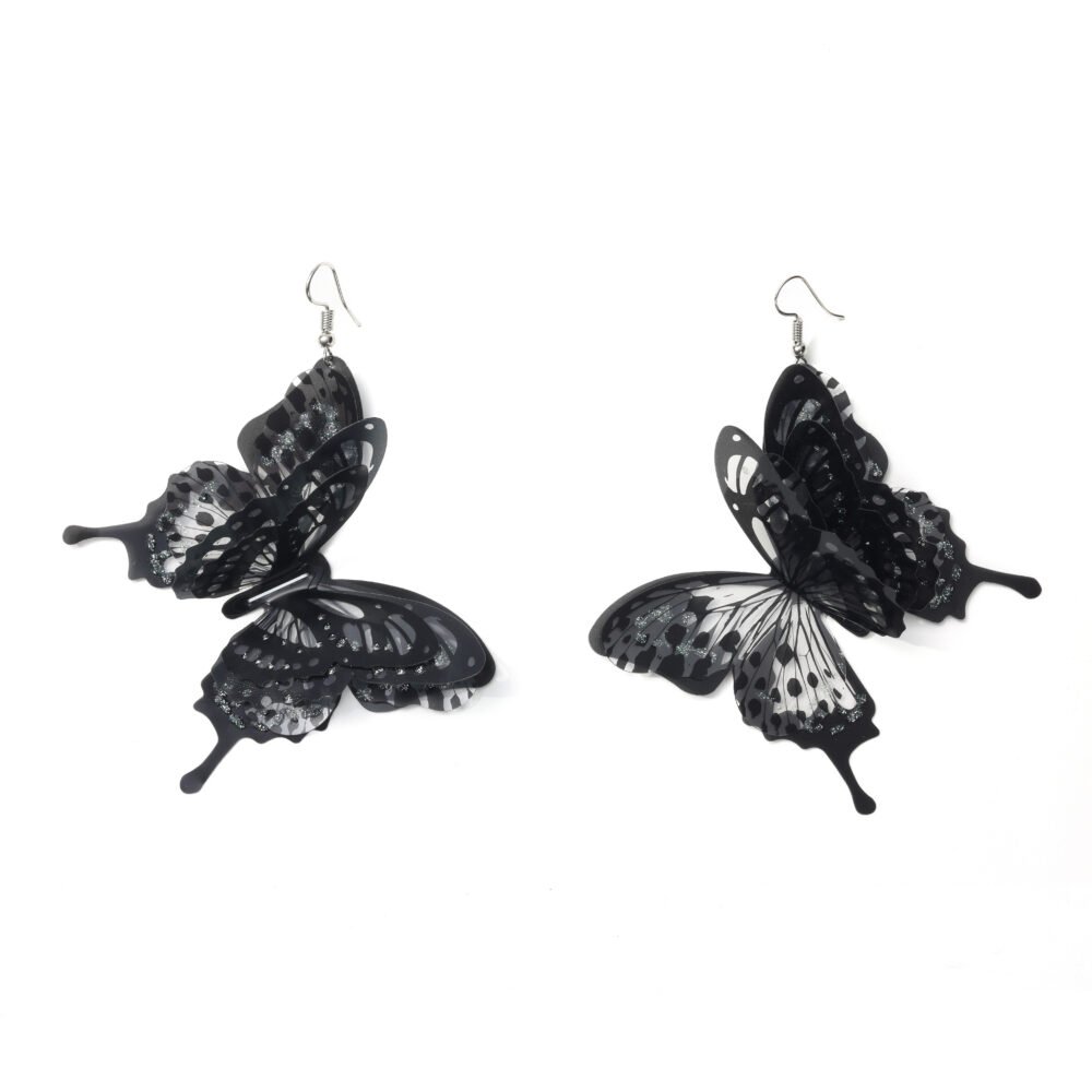 Black layered butterfly drop earrings with translucent wings and glitter accents