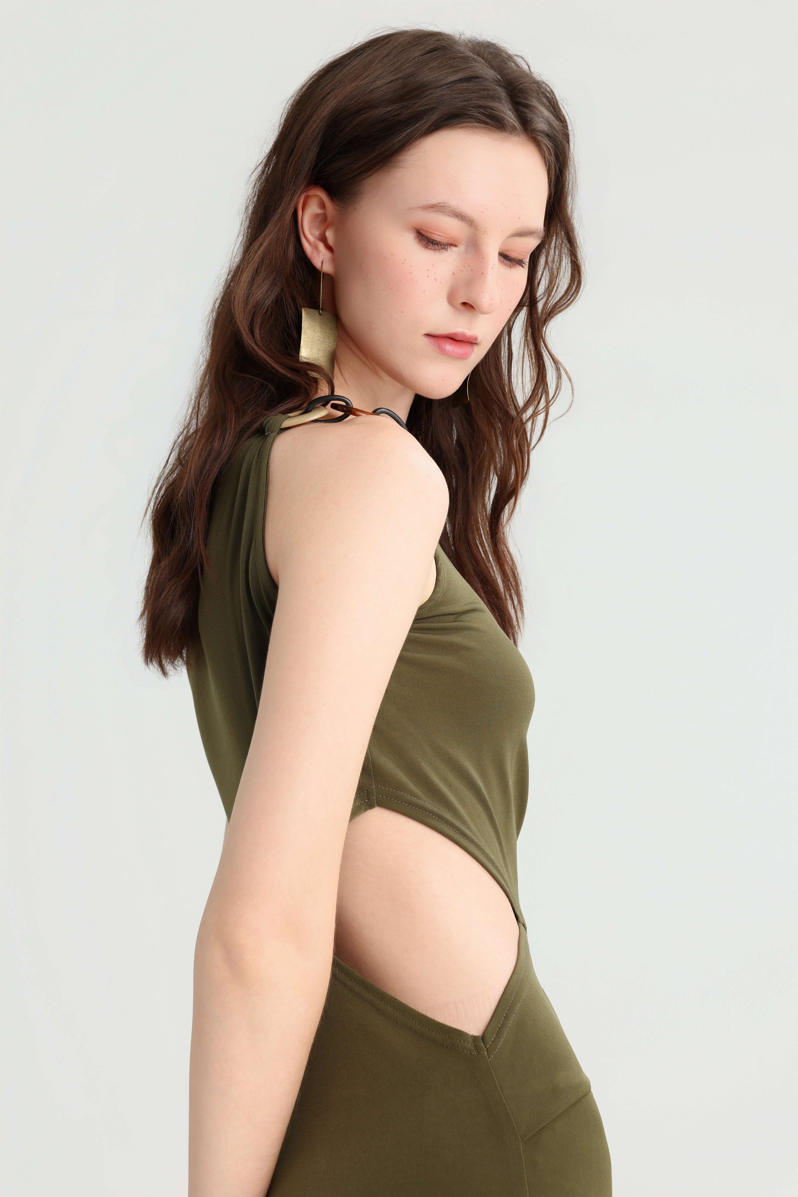Side detail of the curved waist cutout and ruched fabric