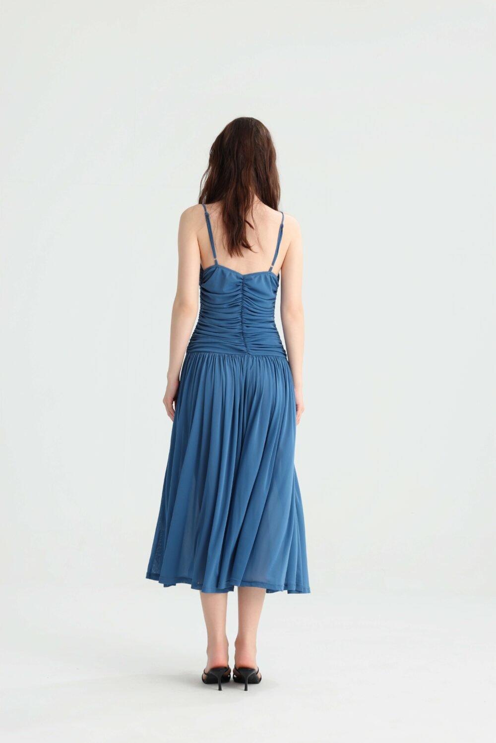Back view of the dusty blue spaghetti strap midi dress