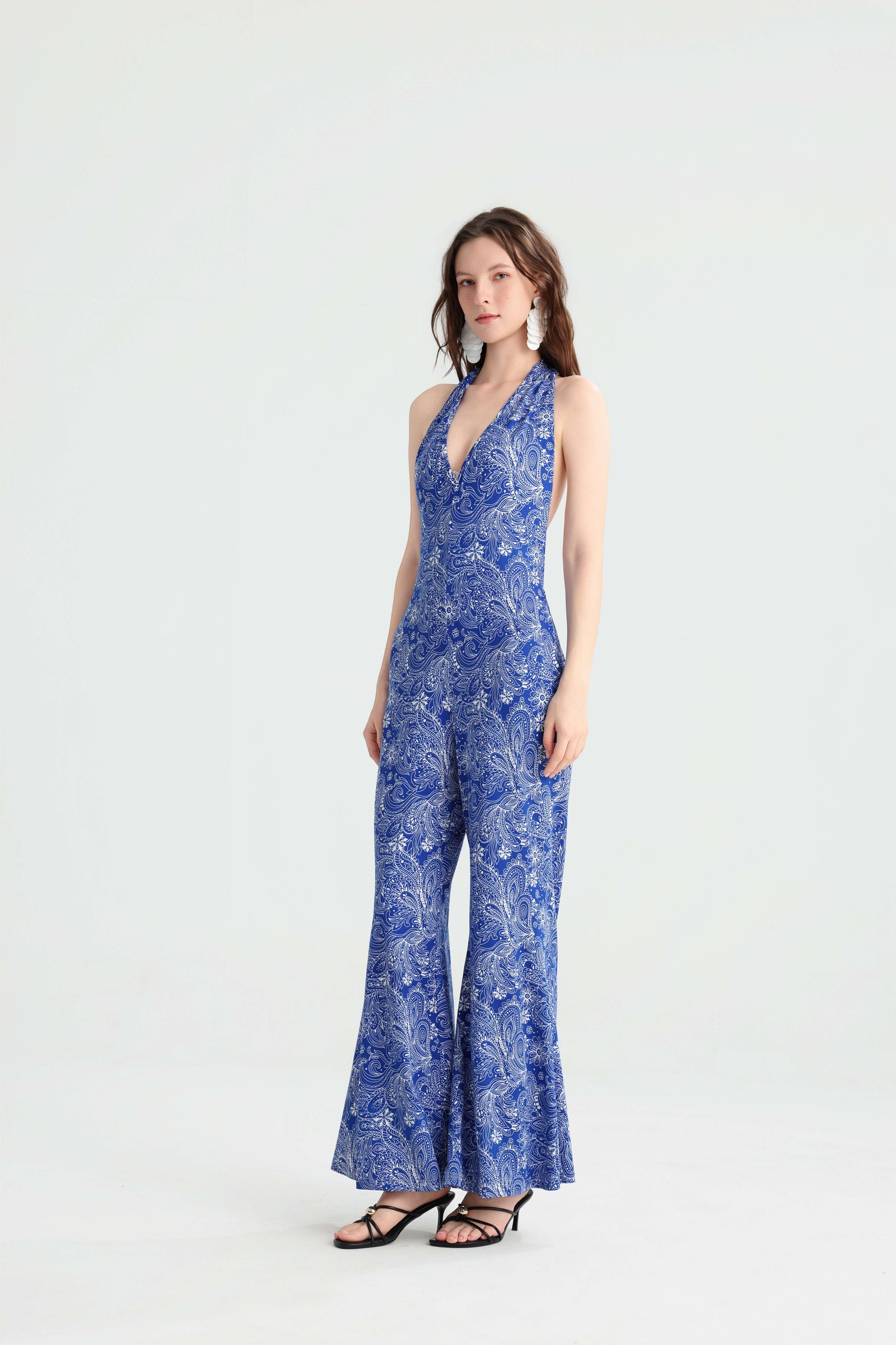 Side view of the fitted blue paisley halter jumpsuit