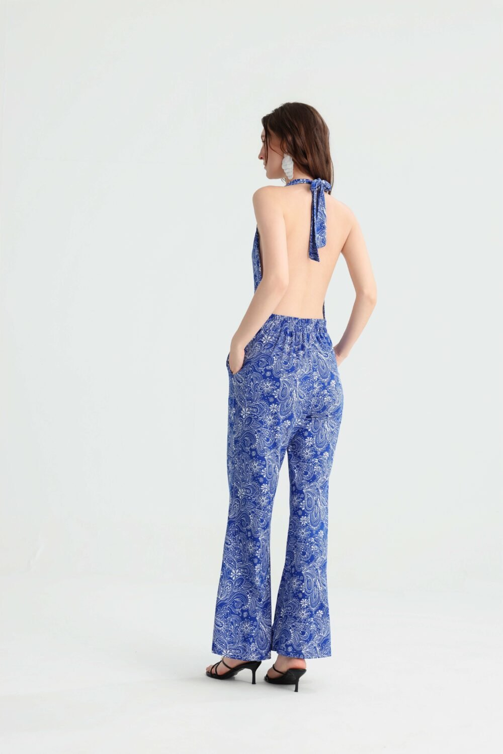 Back view of the blue paisley open-back jumpsuit