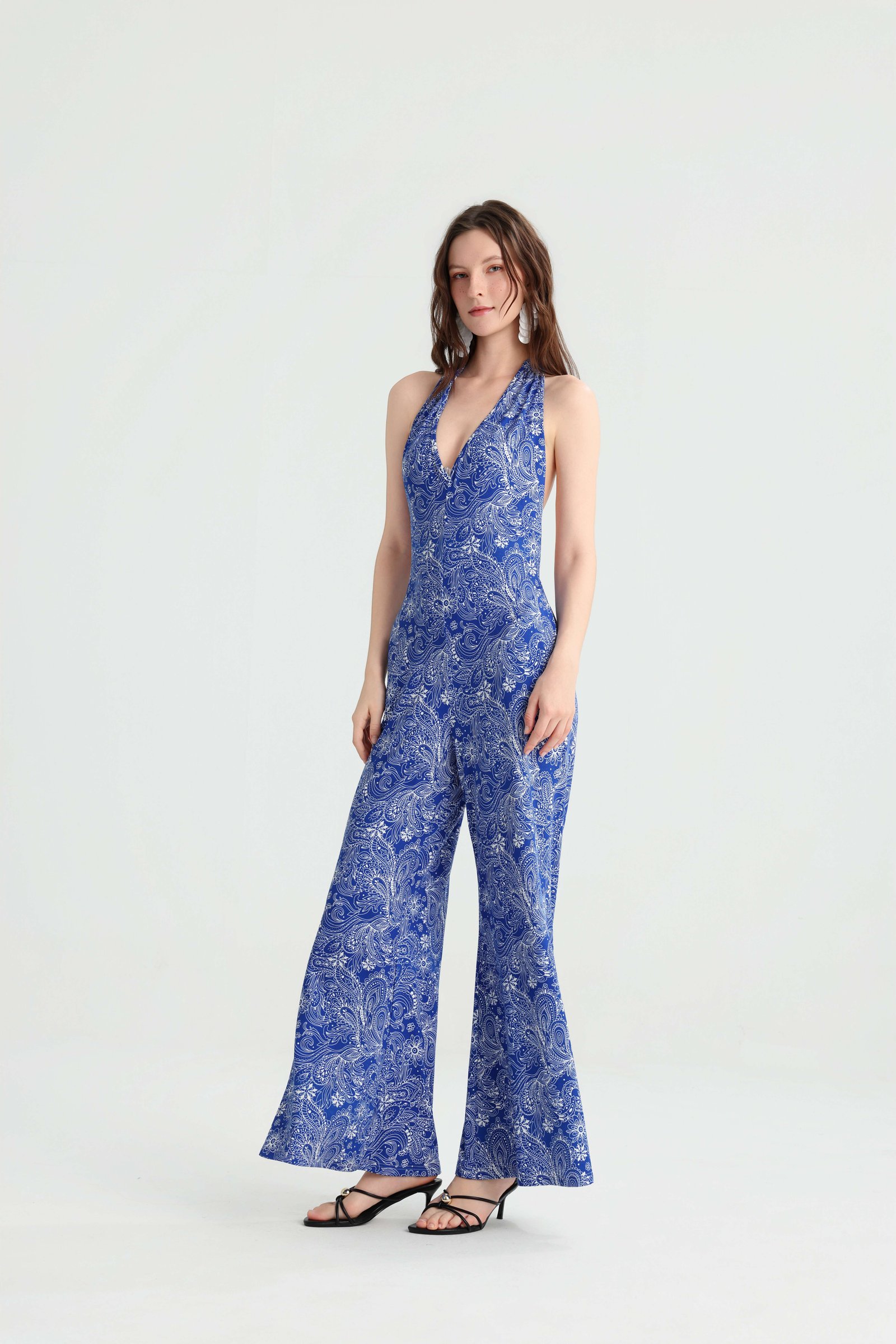 Angled front view of the blue halter vacation jumpsuit
