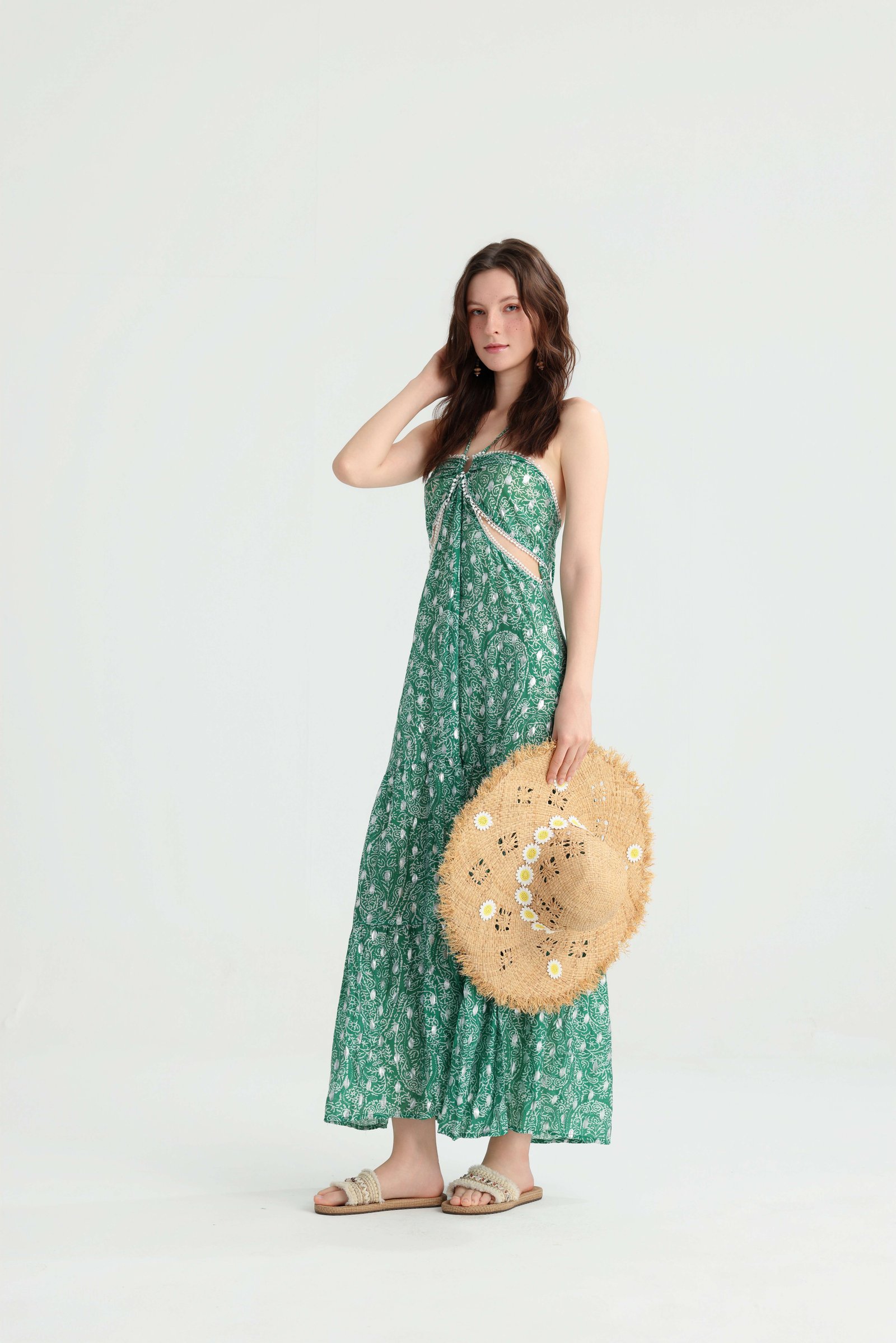 Full-length front view of the green peacock print maxi dress