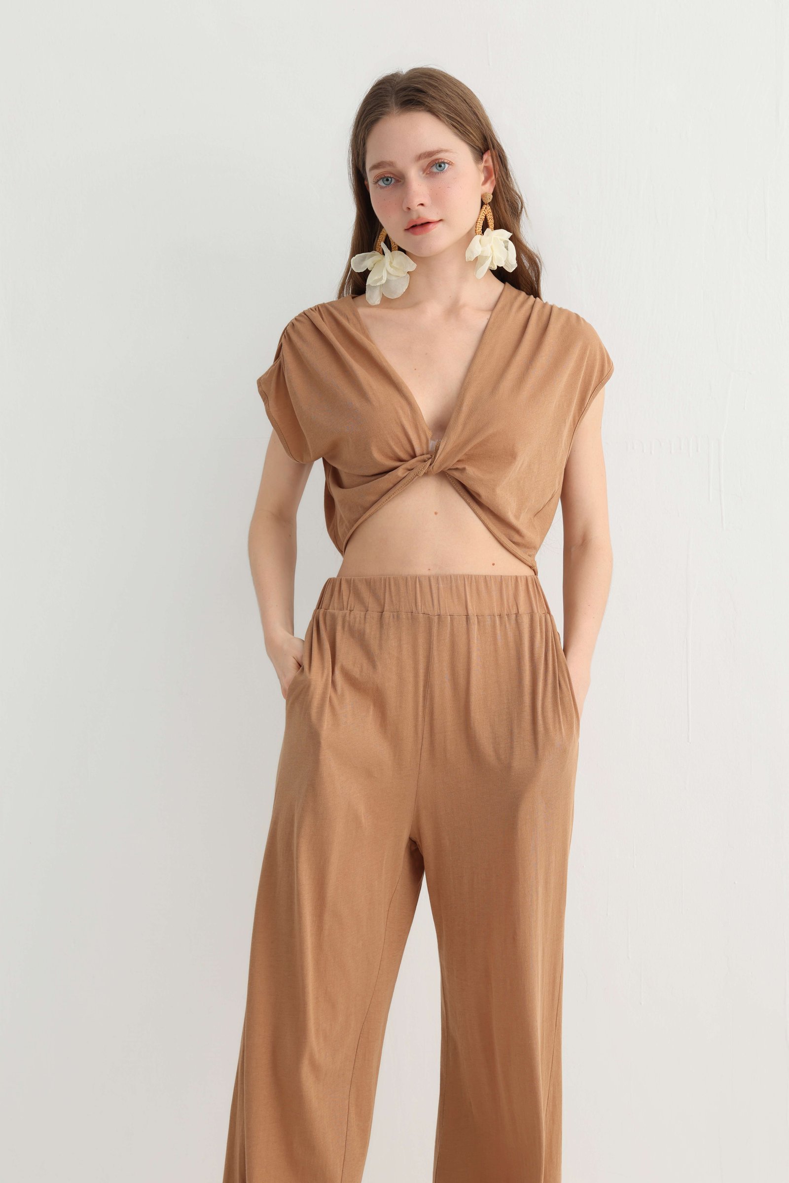 Front detail of the camel twist-front top and wide leg trousers