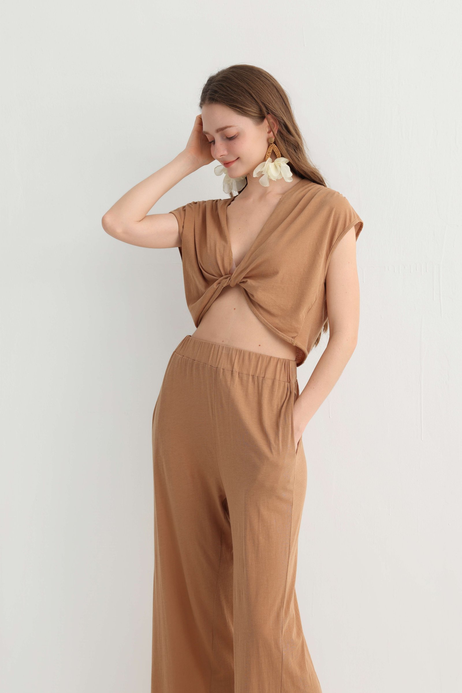 Closer view of the twist-front crop top and elastic waist pants